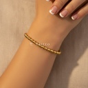 Pulsera dorada de grosor estándar y abierta, diseño de brazalete de cuentas ovaladas lisas y acabado brillante