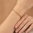 Pulsera dorada rígida, barra redonda con tramos en espiral