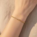 Pulsera dorada rígida, bolitas y segmentos cortos alternados