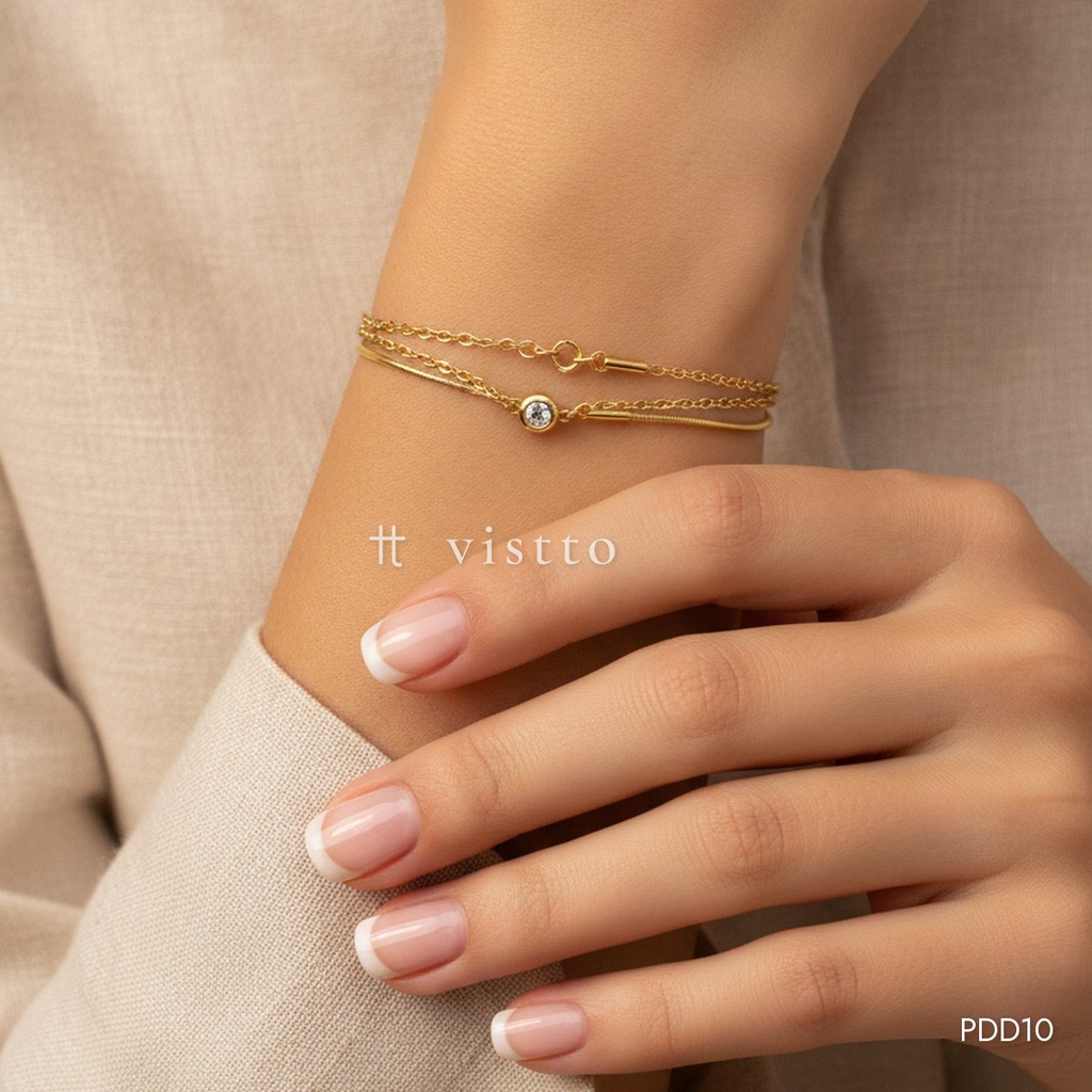 Pulsera dorada, doble cadena con una circonia solitaria
