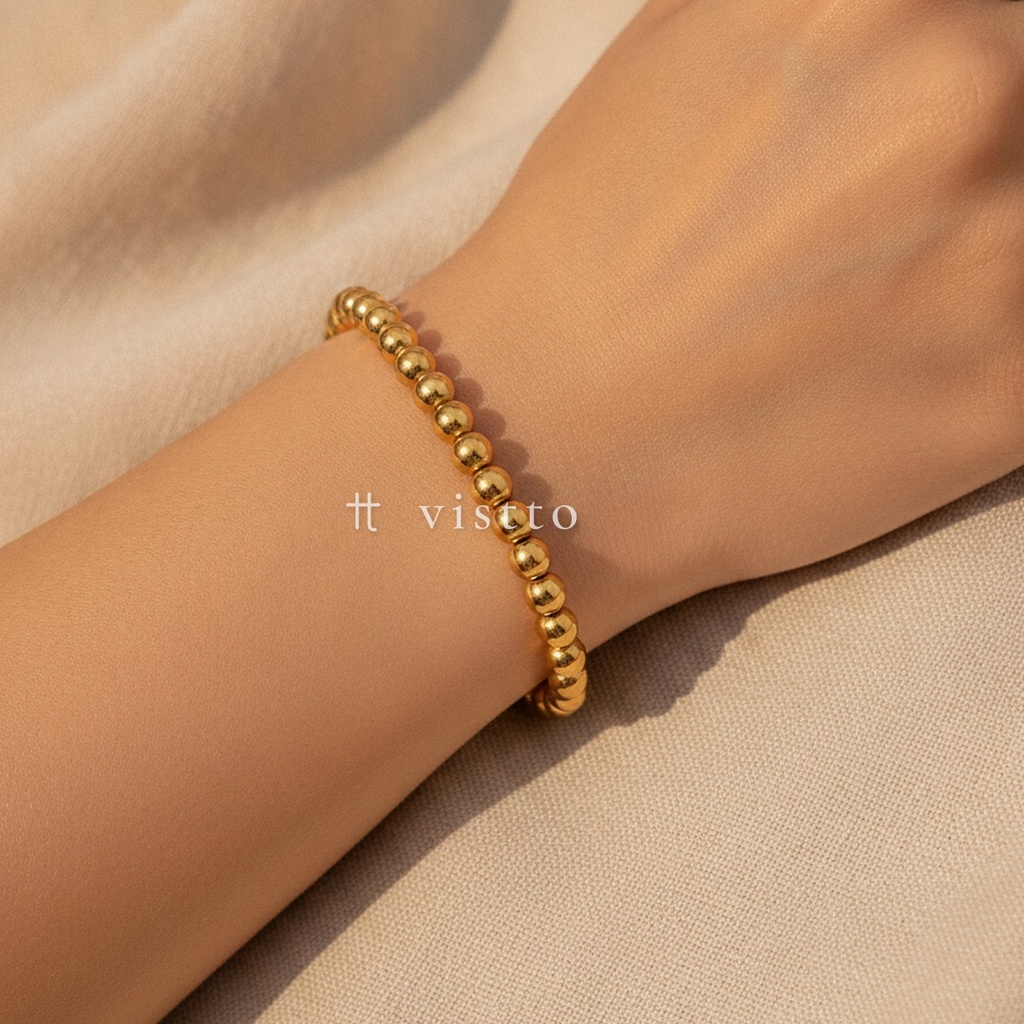 Pulsera dorado elástica, diseño de una hilera de cuentas esféricas de 6 mm con acabado liso y brillante