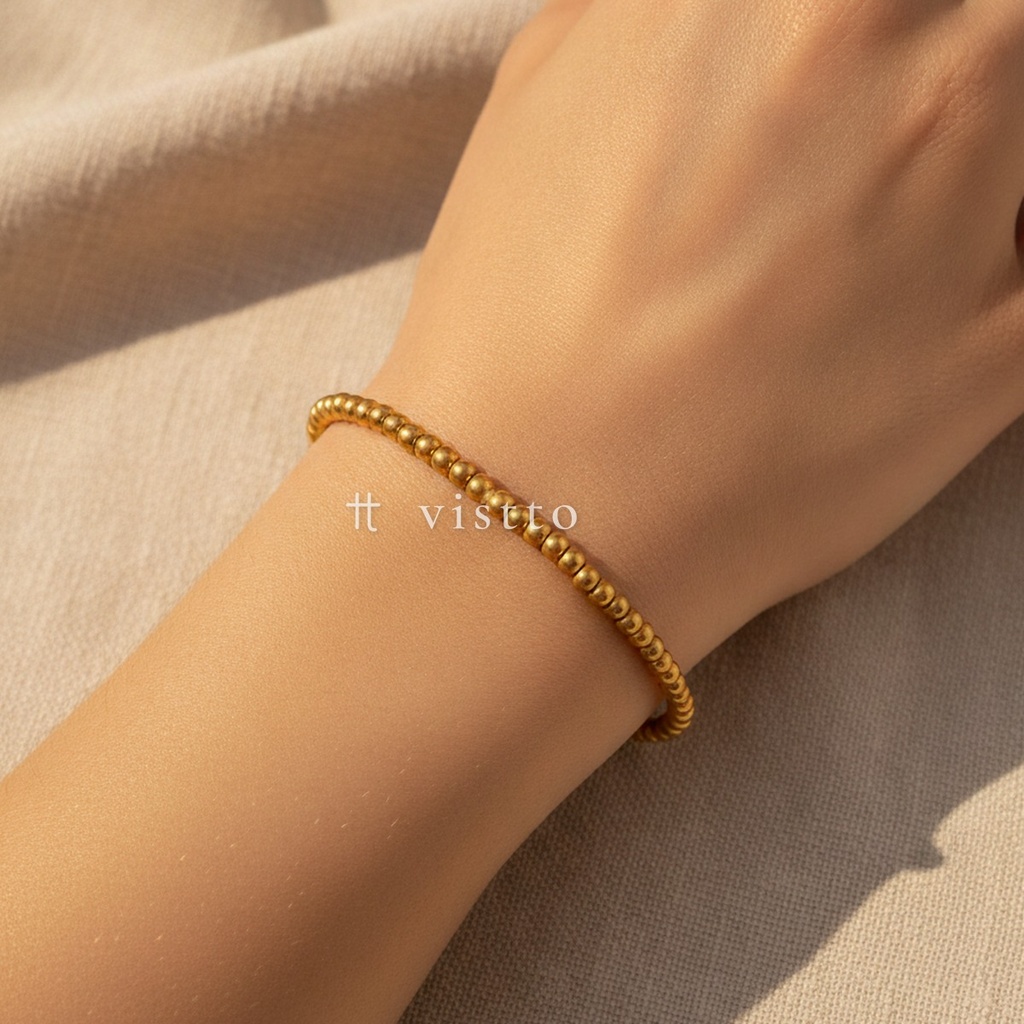 Pulsera dorado elástica, diseño de una hilera de cuentas esféricas de 3 mm con acabado liso y mate
