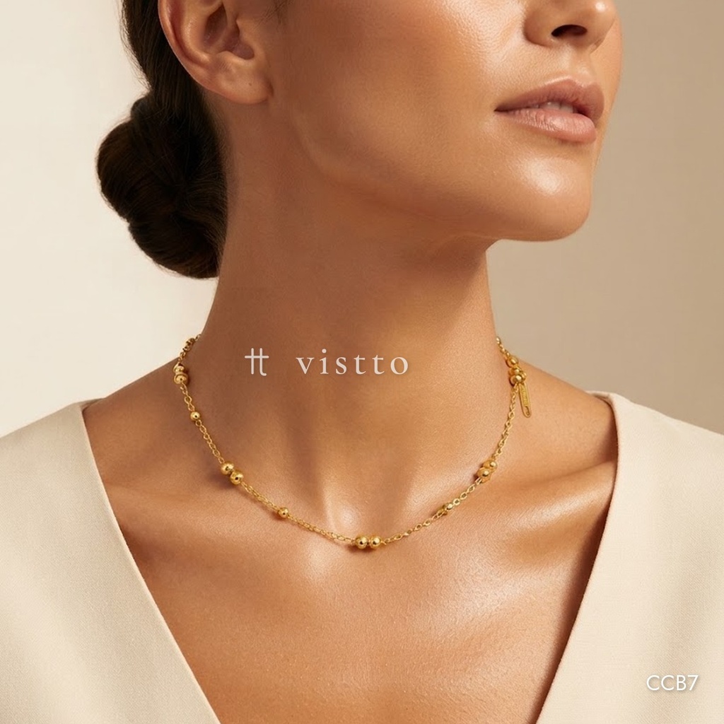 Collar dorado, cadena fina con pares de cuentas intercaladas