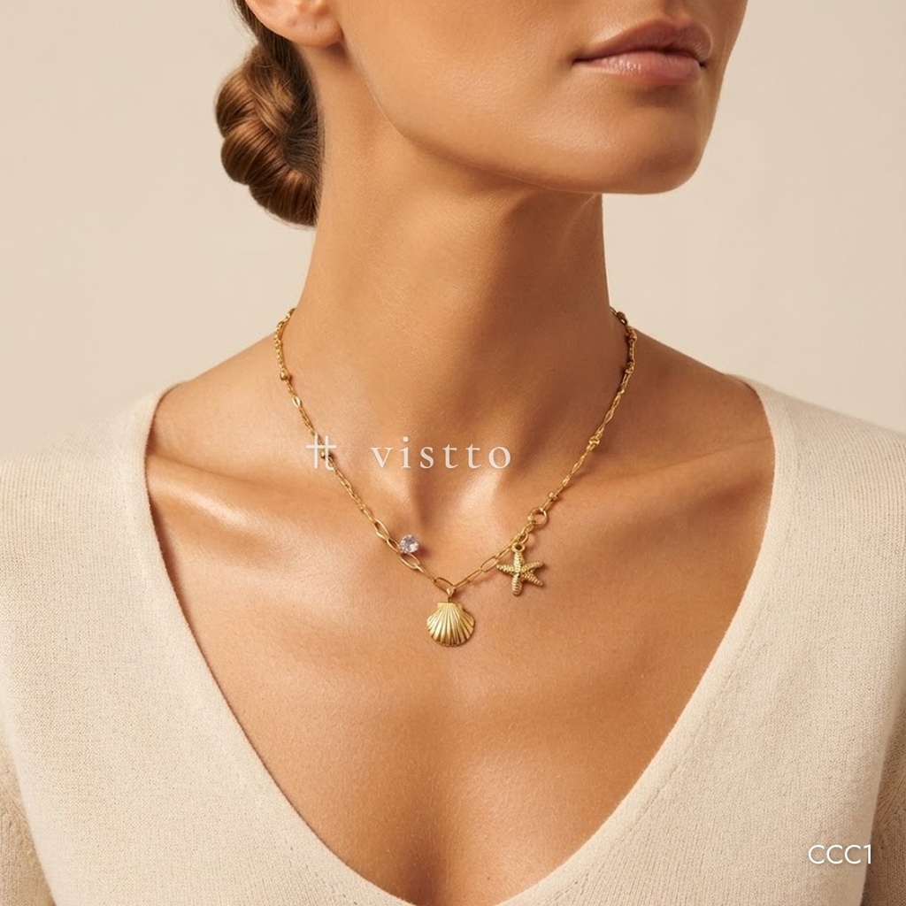 Collar dorado, concha, estrella de mar y circonia