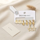 Set de tres pares de zarcillos dorados, estrellas y huggies