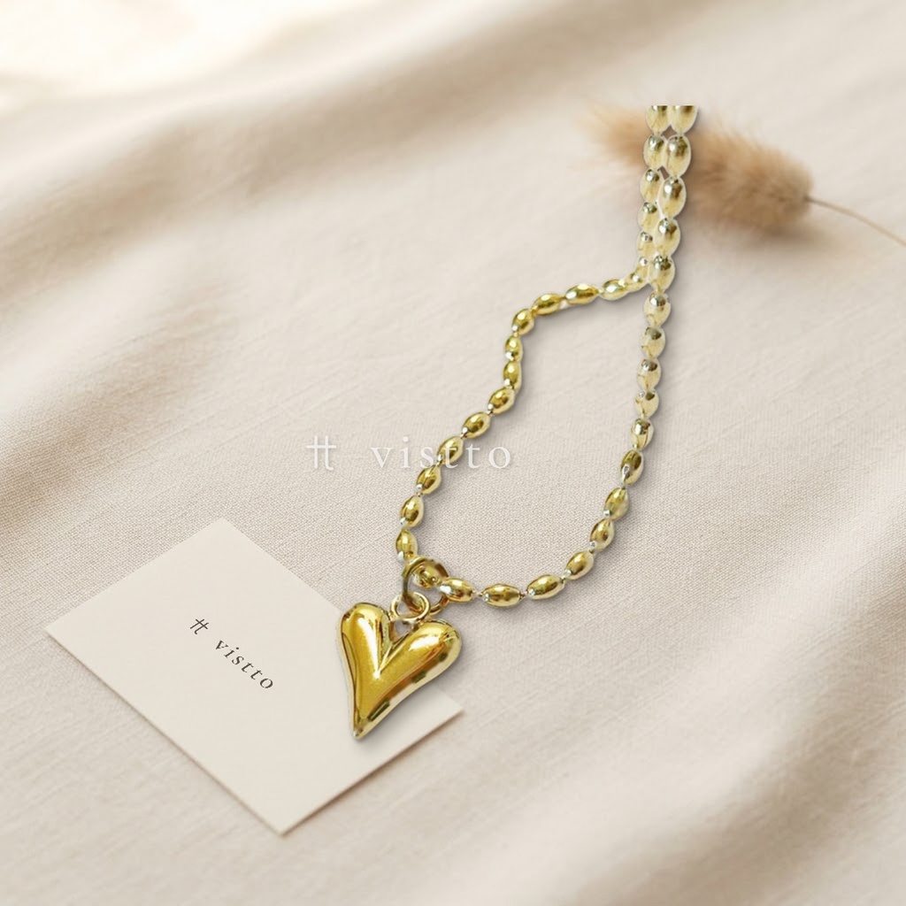Collar dorado de cadena de eslabones ovalados tipo cuenta con dije de corazón alargado liso