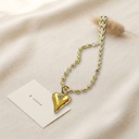Collar dorado de cadena de eslabones ovalados tipo cuenta con dije de corazón alargado liso
