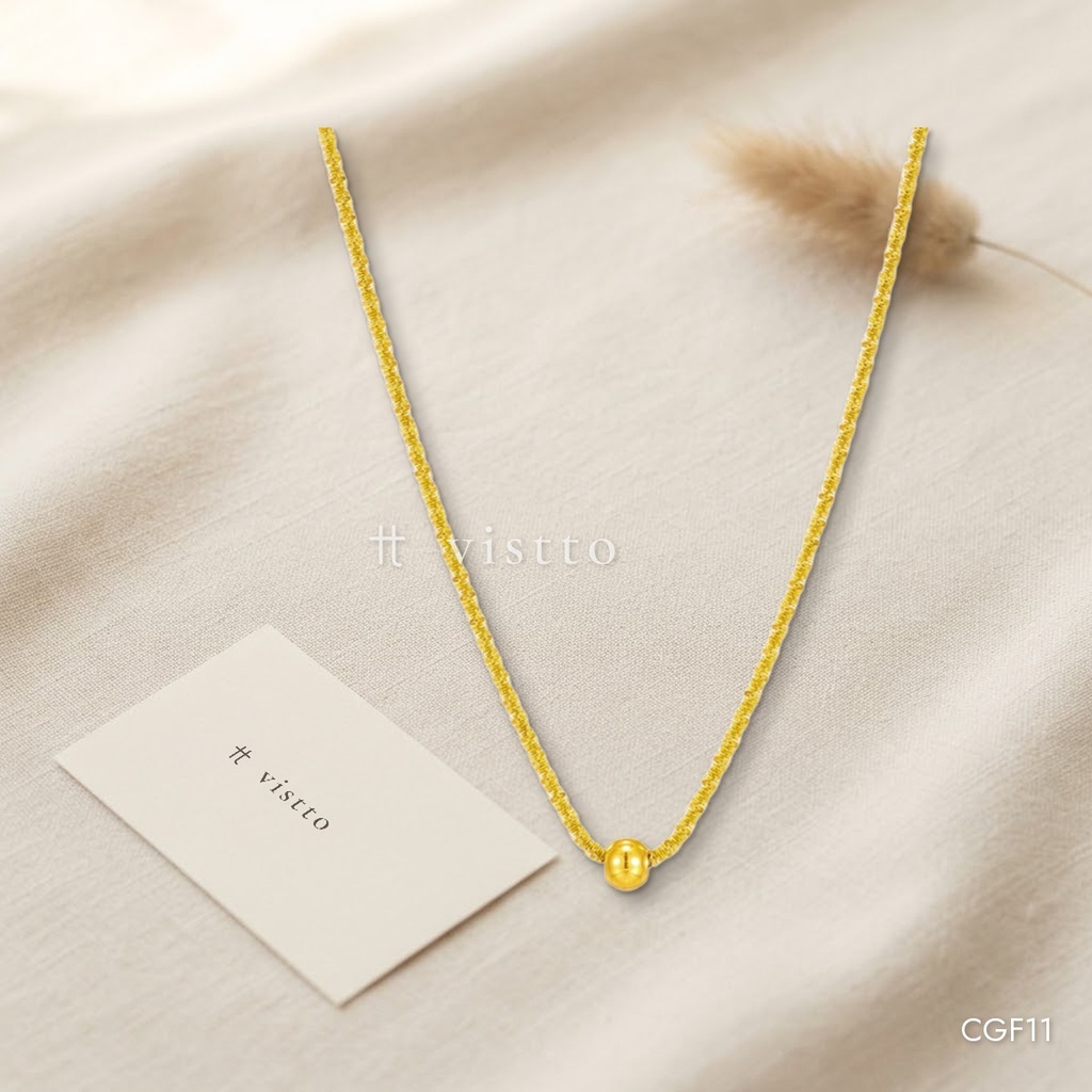 Collar dorado, destellante con esfera central