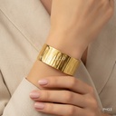 Pulsera dorada ancha, rígida, textura de corteza