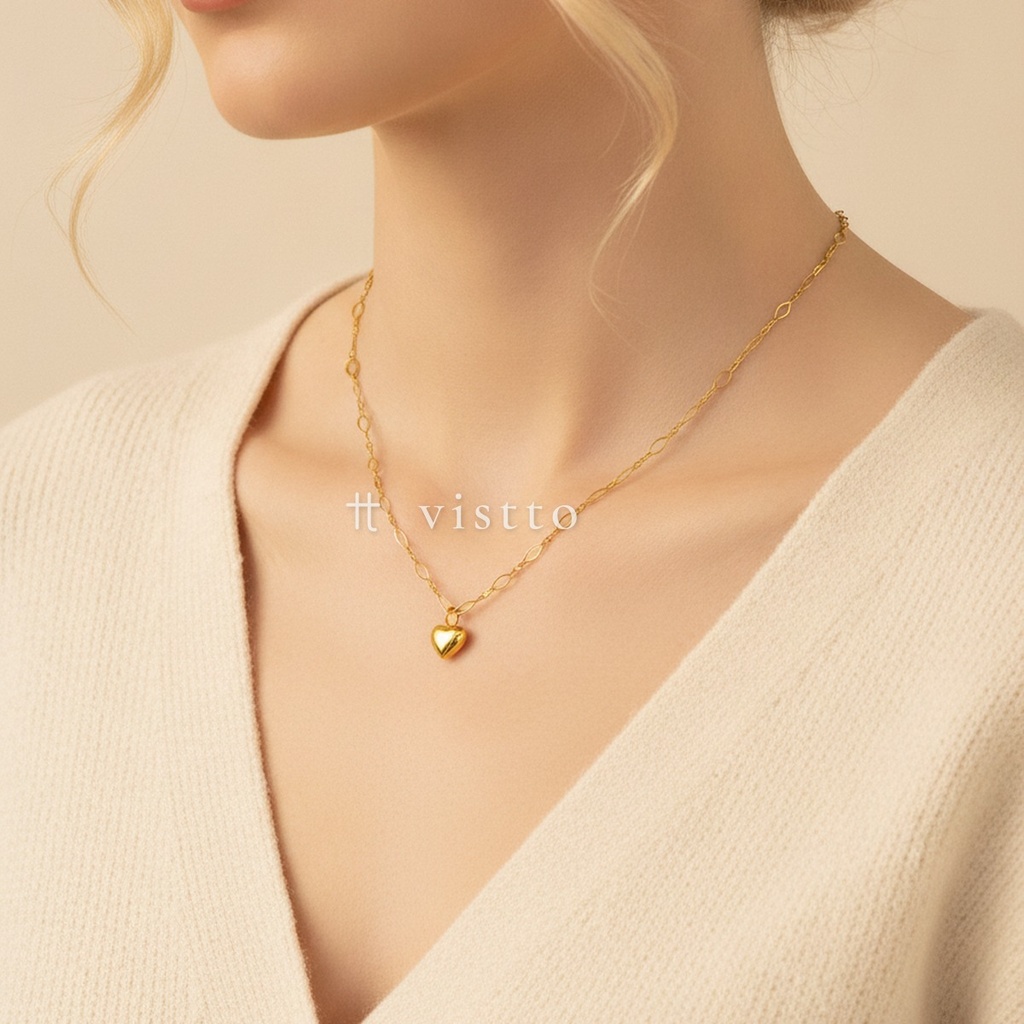 Collar dorado de cadena de eslabones mixtos ovalados y alargados, con dije colgante en forma de corazón pequeño