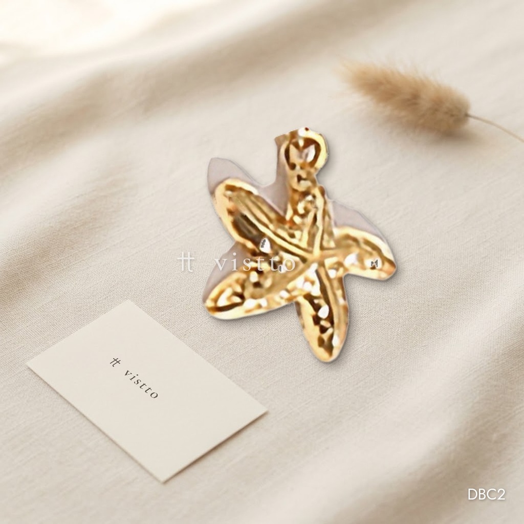 Dije dorado, estrella de mar