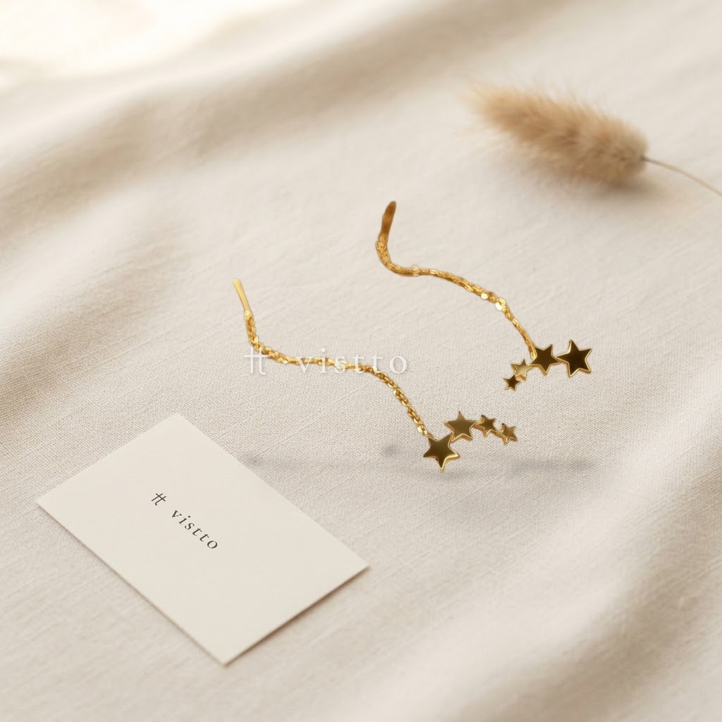 Zarcillos dorados de cadena pasante, diseño de cadena fina larga con cuatro estrellas lisas en degradé de tamaño