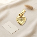 Dije dorado, corazón con una circonia amarilla clara