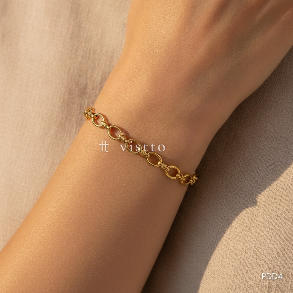 Pulsera dorada, eslabones ovalados unidos por conectores de barra