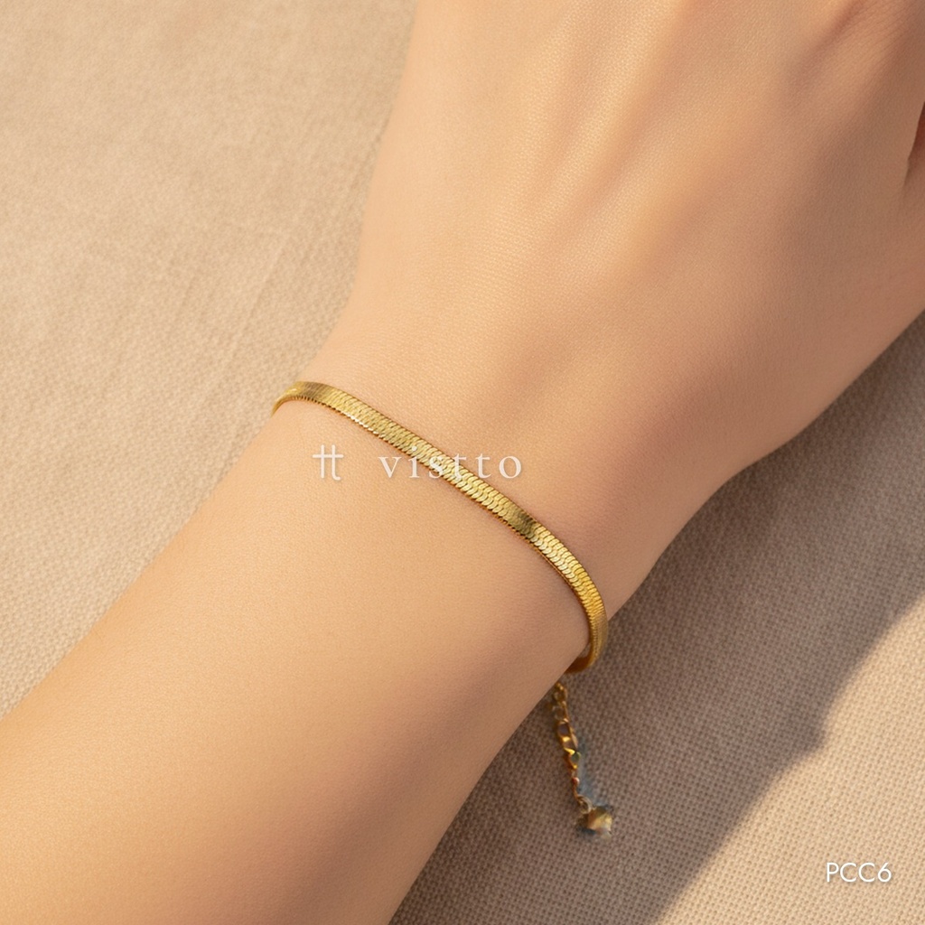Pulsera dorada, cadena en espiga con corazón final