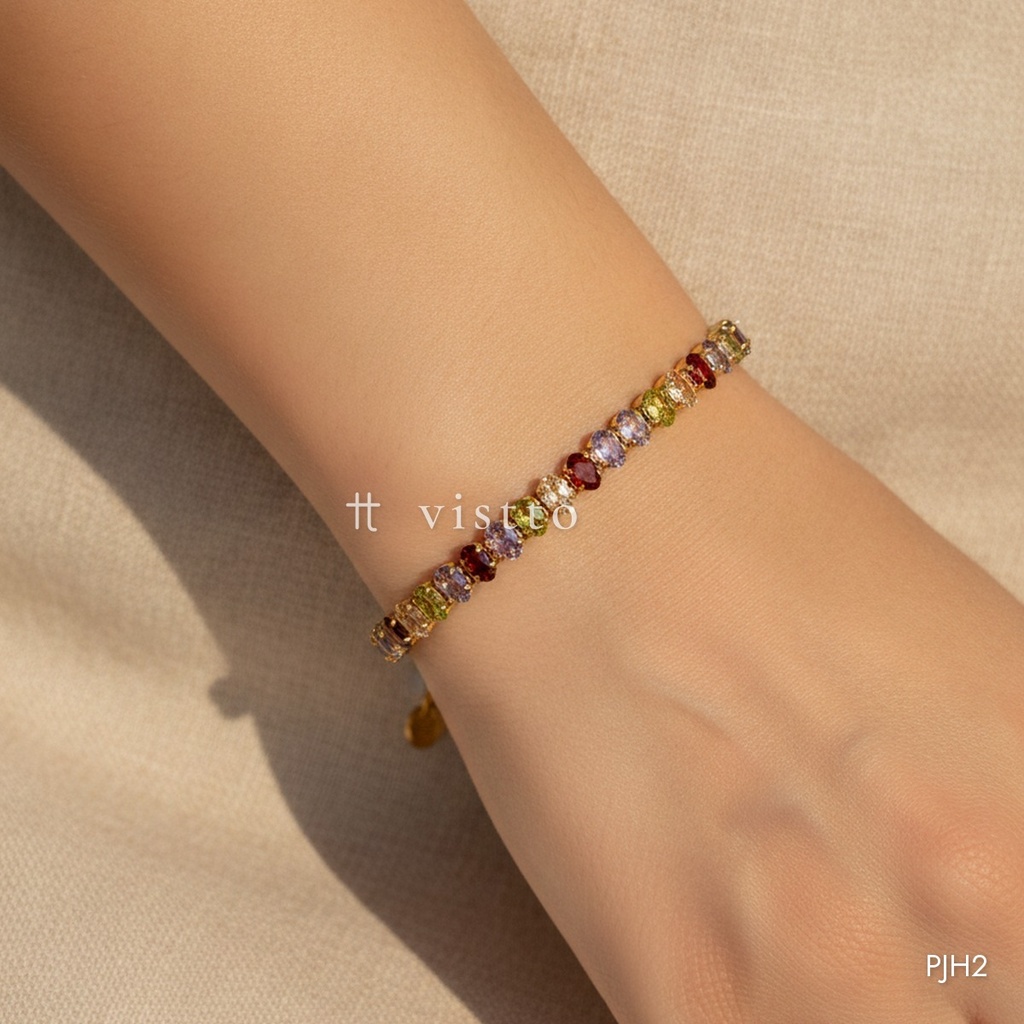Pulsera dorada, línea de circonias ovaladas multicolor