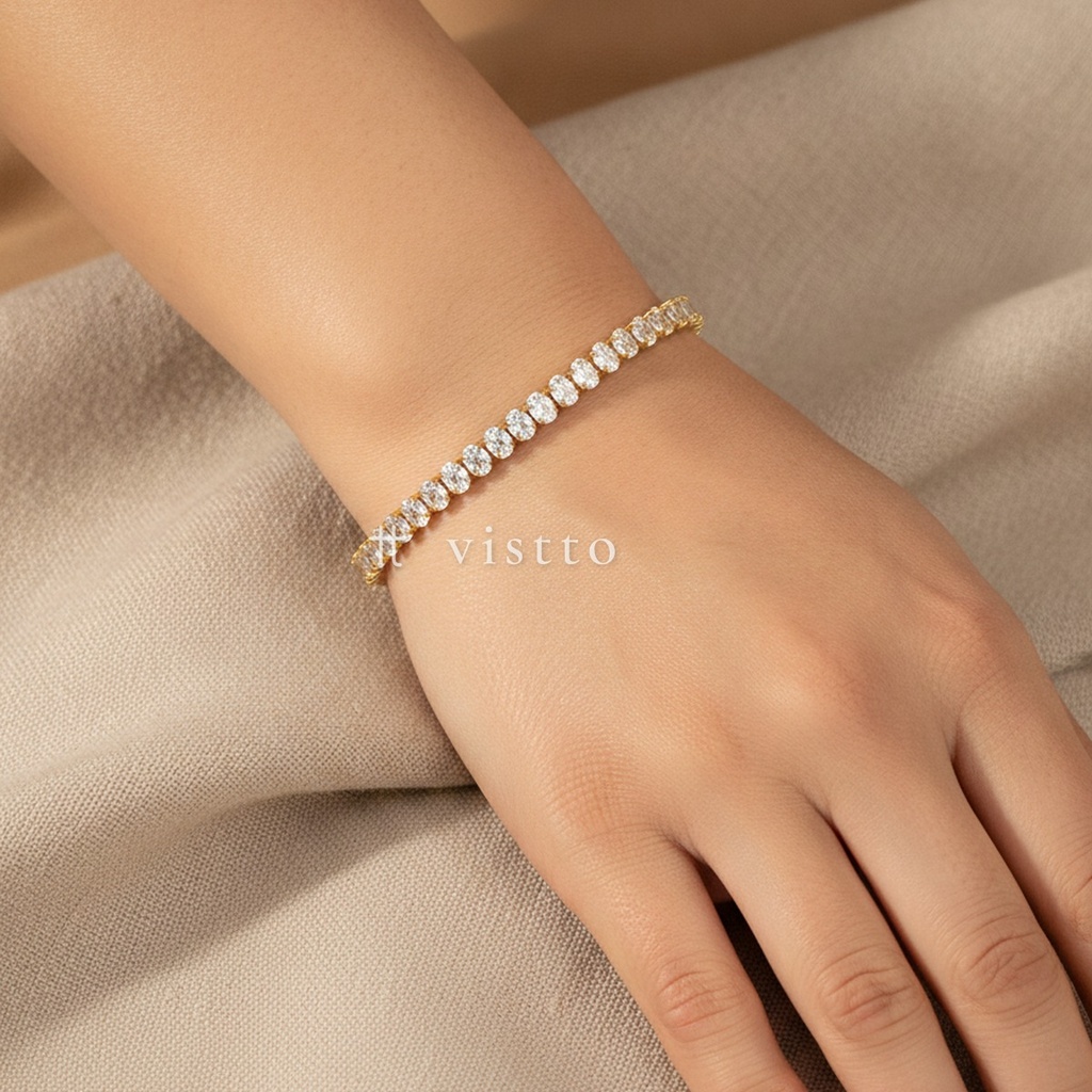 Pulsera dorada fina, diseño de línea continua de circonias cúbicas ovaladas transparentes y cierre de langosta con extensor